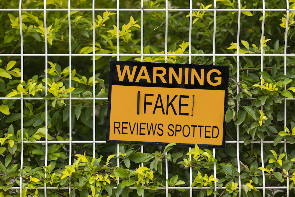 Fake Reviews Sign | How To Deal With Fake Negative Reviews | DeWinter Marketing & PR Denver Colorado